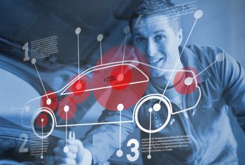 A man looking at a computer generated outline image of a car.