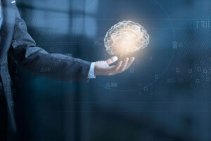 Holding AI "brain" in the hand of a businessperson.